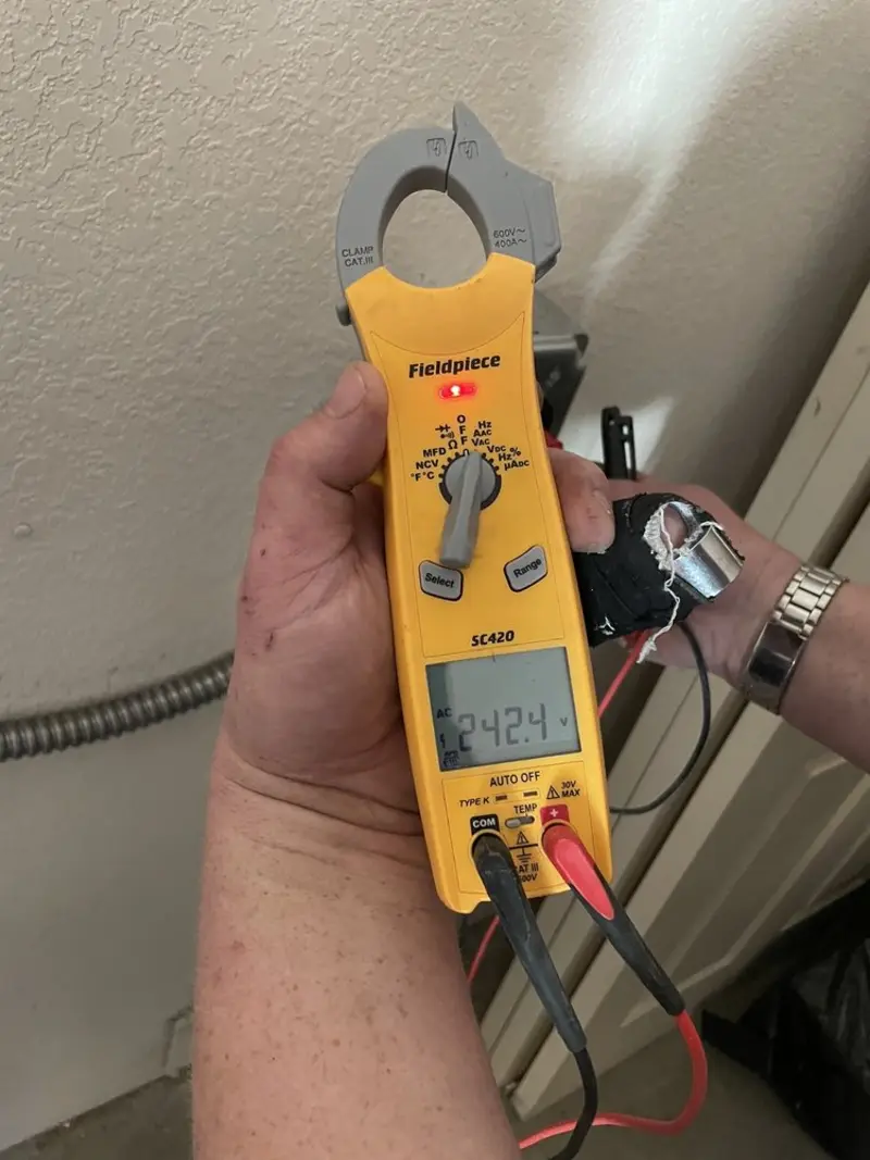 Voltage testing with clamp meter during Generator Installation in Schoolcraft